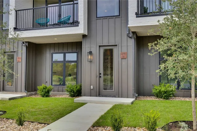a view of a house with a yard and plants