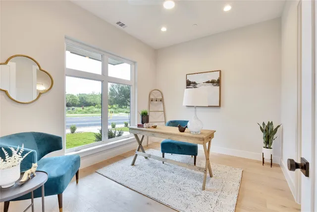 a workspace with furniture and window