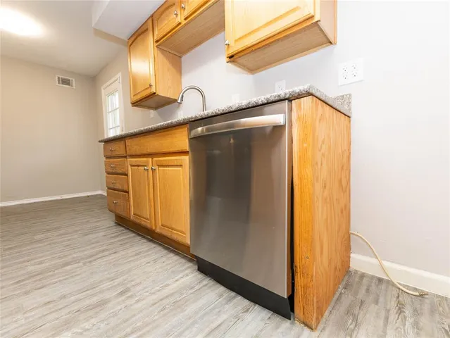 a view of a garage with wooden floor