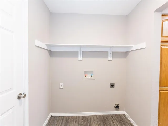 a view of utility room with closet