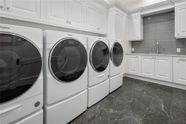 a utility room with dryer and washer