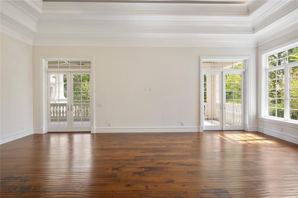 8707 Northwest 31st Lane Road Ocala, FL 34482 - Photo 23 of 50 a view of an empty room with wooden floor and a window