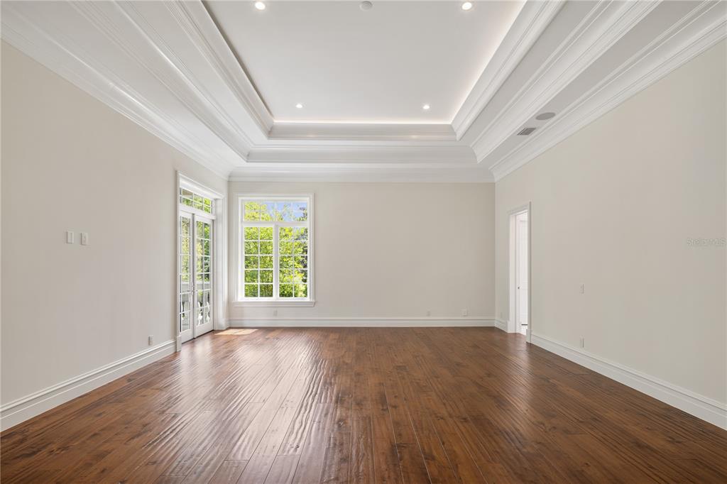 8707 Northwest 31st Lane Road Ocala, FL 34482 - Photo 26 of 50 a view of an empty room with wooden floor and a window