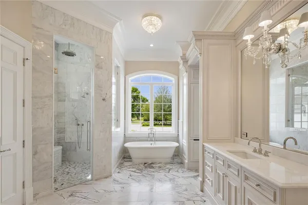 a bathroom with double vanity sink and a mirror