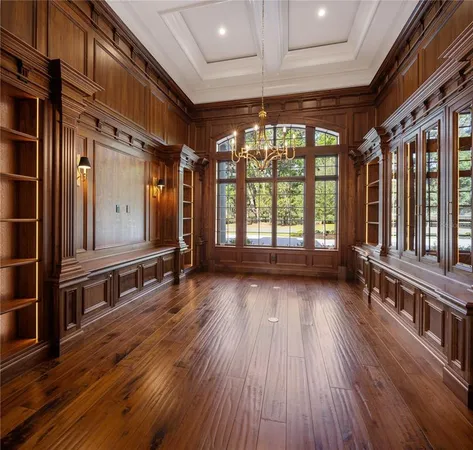 a view of front door with wooden floor