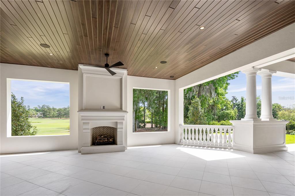 8707 Northwest 31st Lane Road Ocala, FL 34482 - Photo 47 of 50 a view of an empty room with a fireplace and a window