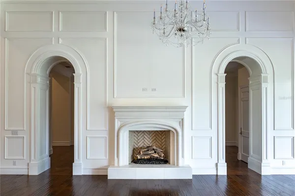 a view of a chandelier in big room and chandelier