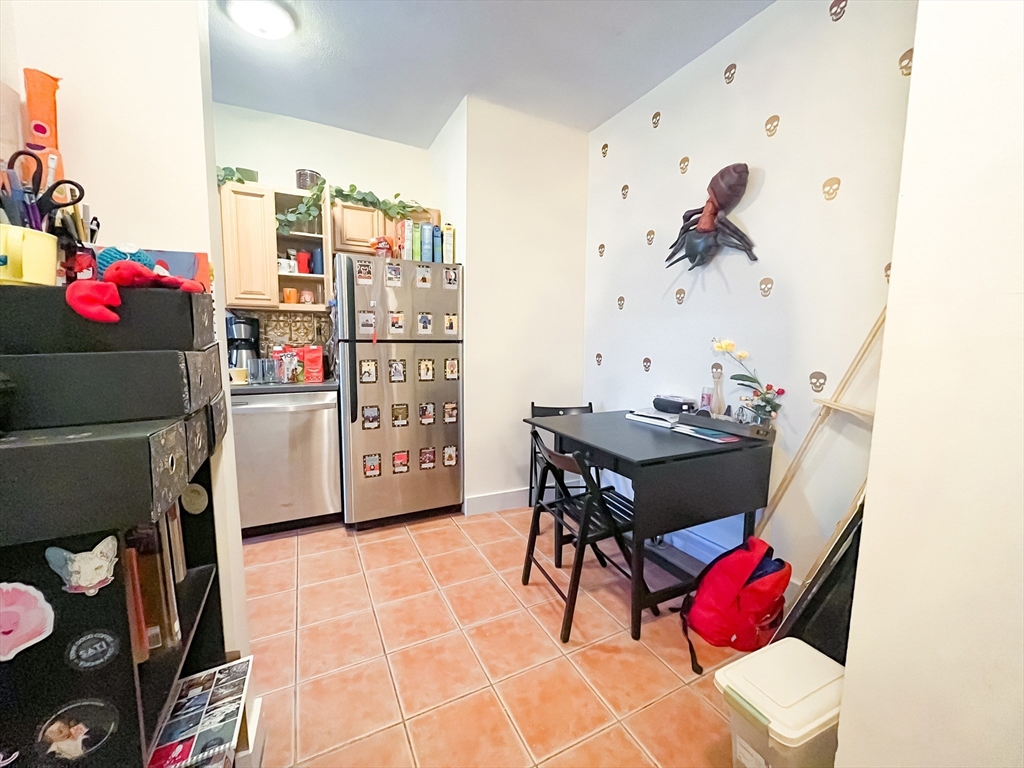 12 Ransom Road, Unit 6 Boston, MA 02135 - Photo 6 of 16 a living room with furniture and a table