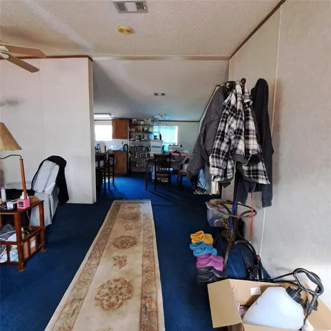 a view of a room with wooden floor and closet