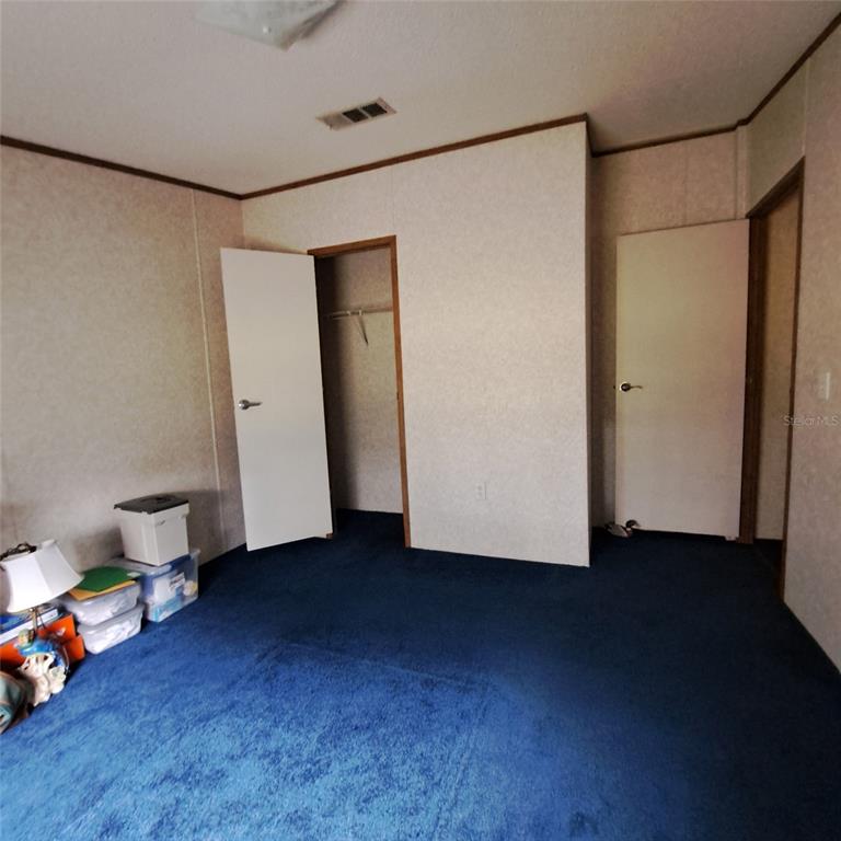 2804 Southwest 67th Lane Bushnell, FL 33513 - Photo 42 of 48 a view of a room with wooden floor and closet