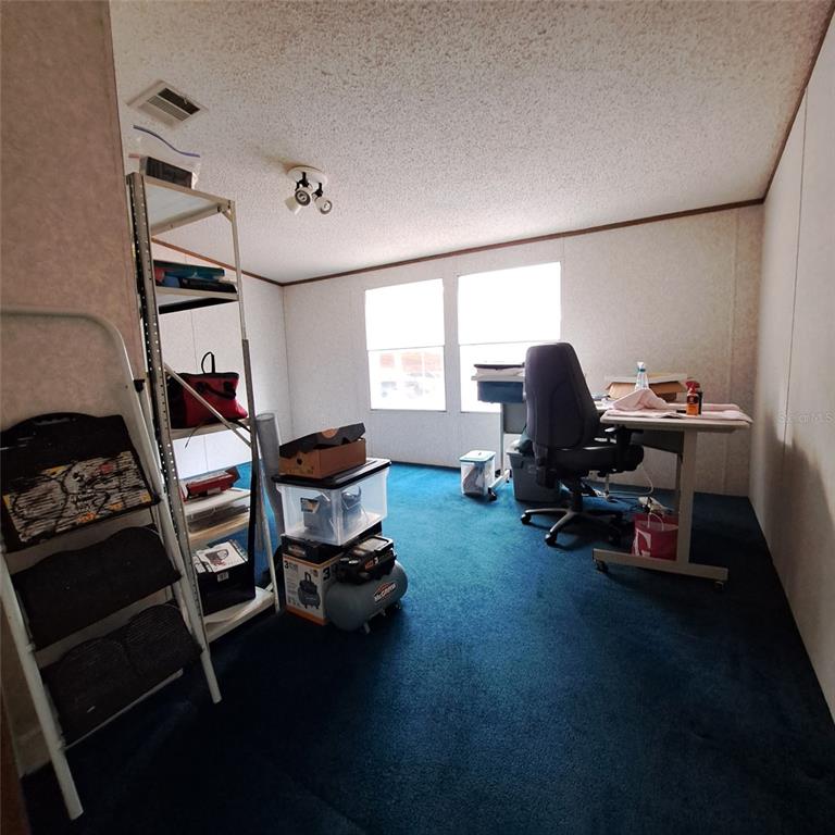 2804 Southwest 67th Lane Bushnell, FL 33513 - Photo 43 of 48 a room with furniture and a window