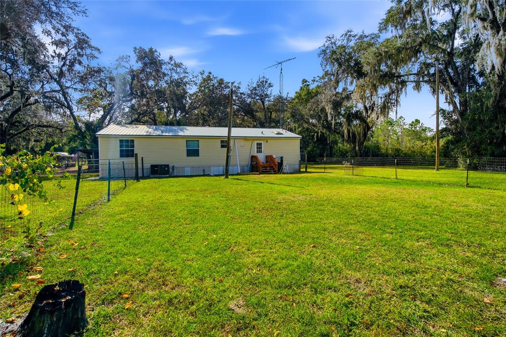 2804 Southwest 67th Lane Bushnell, FL 33513 - Photo 10 of 48 a view of a house with a yard and sitting area