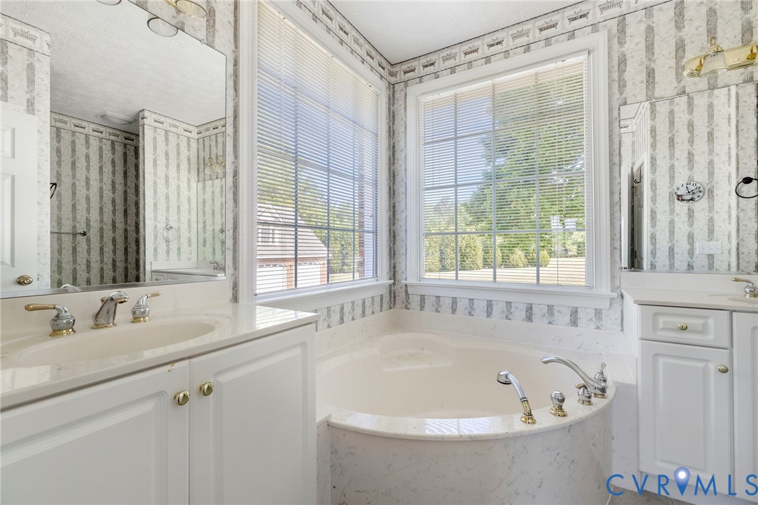 15441 Goshen Road Montpelier, VA 23192 - Photo 25 of 47 a bathroom with a bathtub and a sink