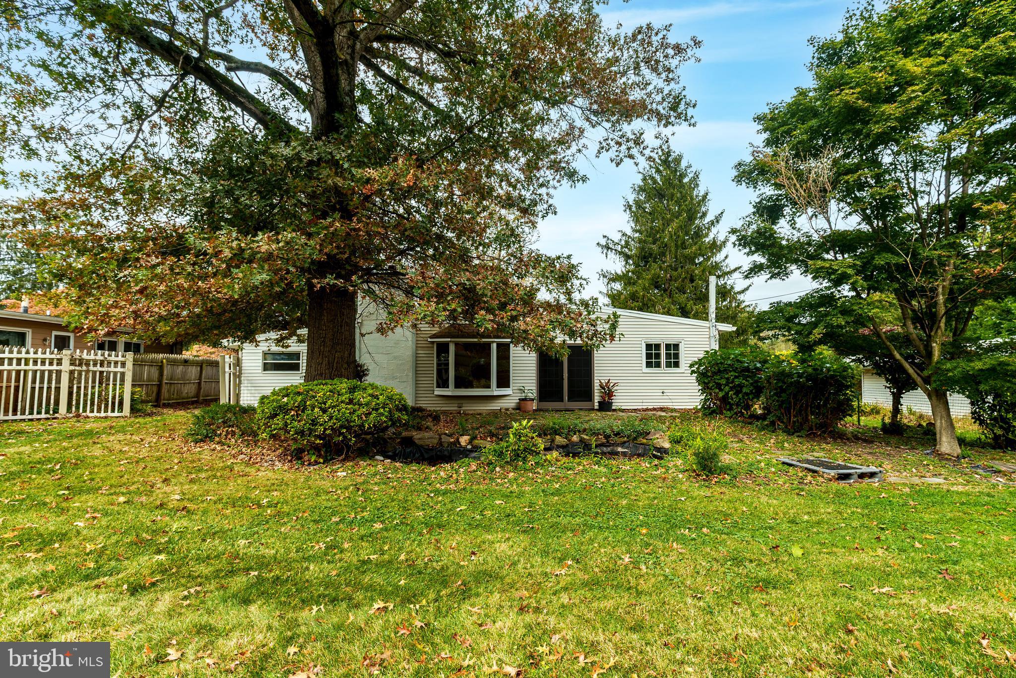 548 Paddock Road Ambler, PA 19002 - Photo 15 of 15 a backyard of a house with plants and tree