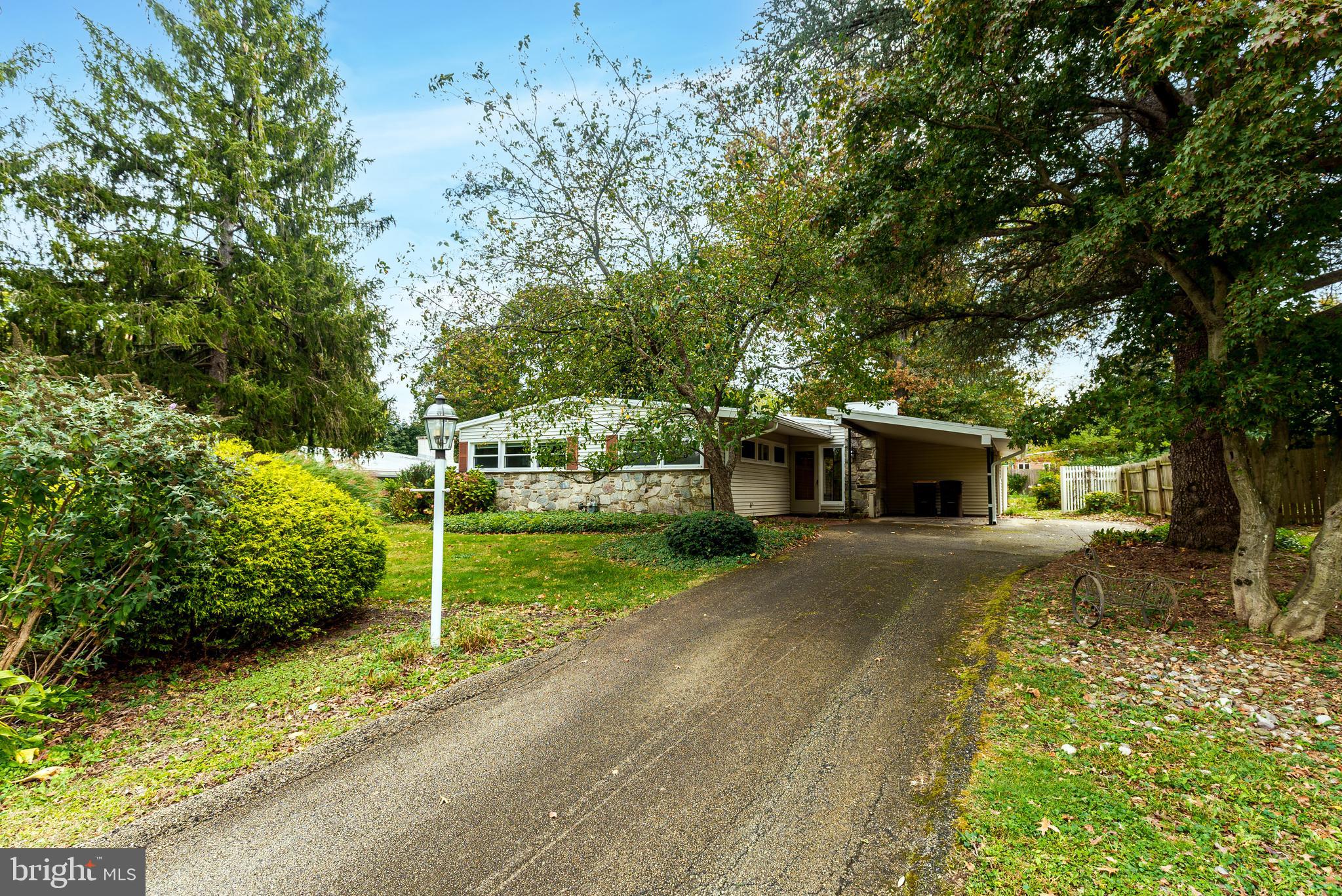 548 Paddock Road Ambler, PA 19002 - Photo 2 of 15 a front view of a house with garden