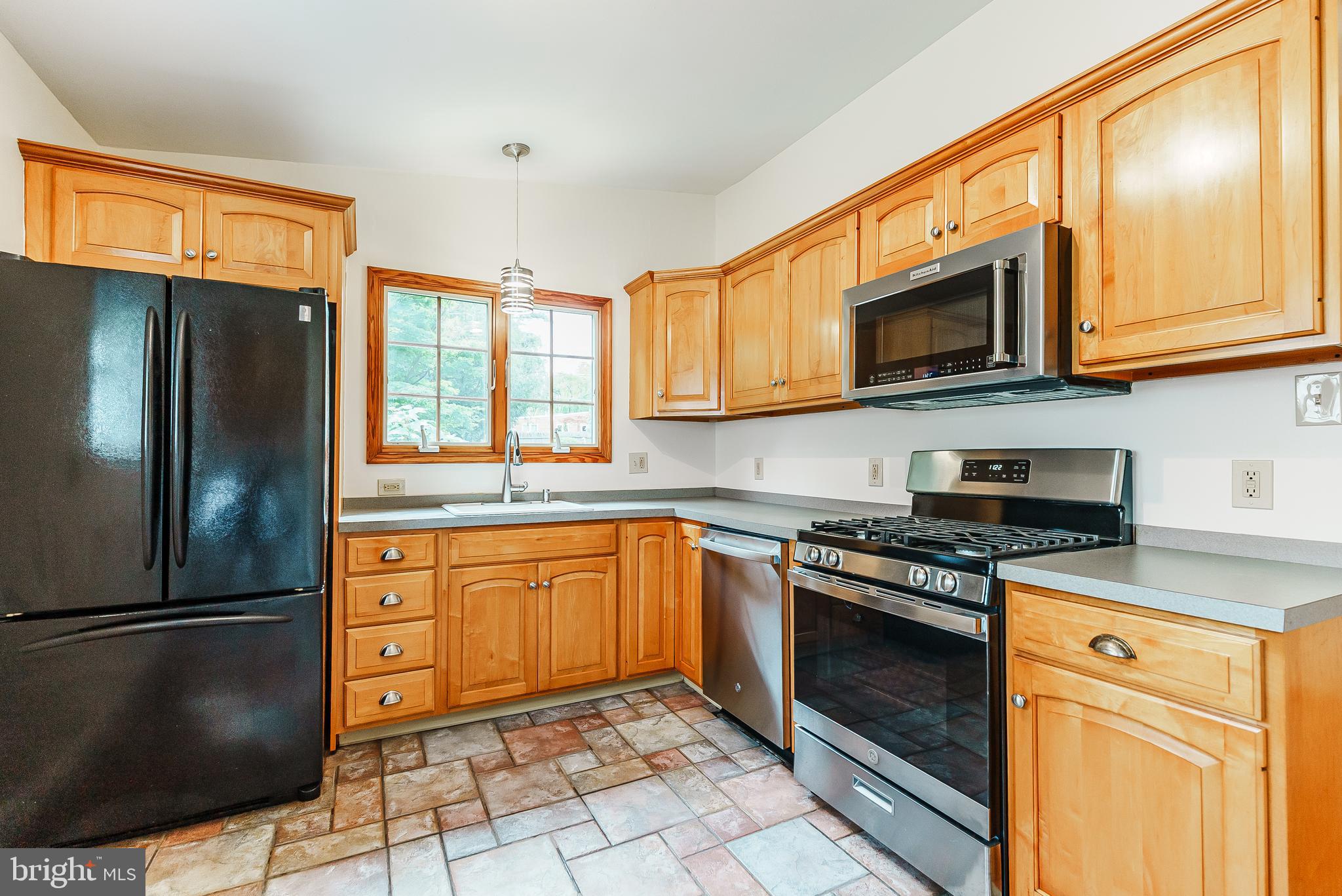 548 Paddock Road Ambler, PA 19002 - Photo 5 of 15 a kitchen with stainless steel appliances granite countertop a refrigerator stove top oven and sink