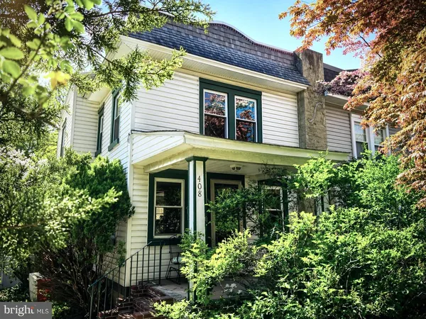 front view of a house with a garden