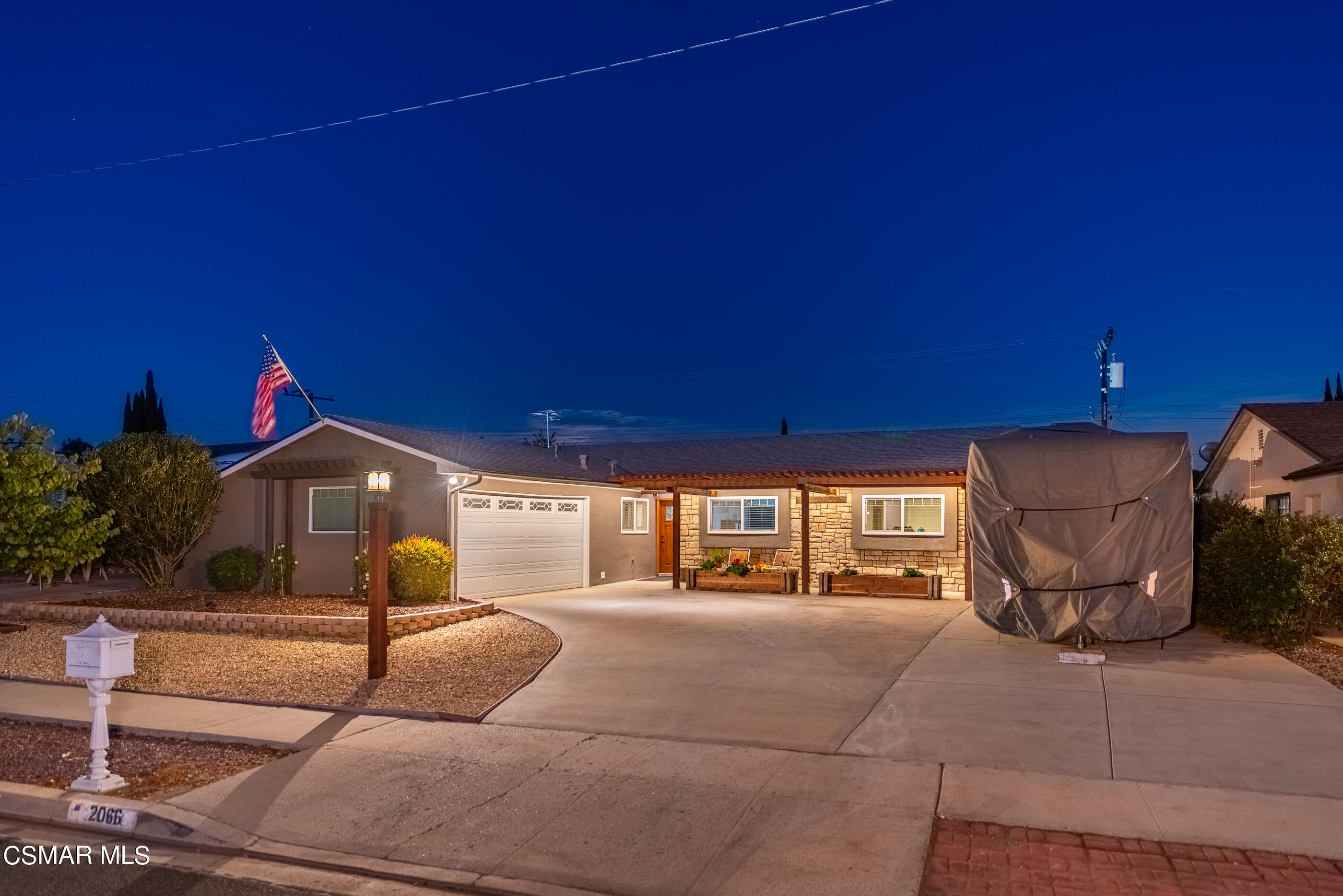 2066 Hurles Avenue Simi Valley, CA 93063 - Photo 1 of 50 a front view of a house with basket ball court and glass windows