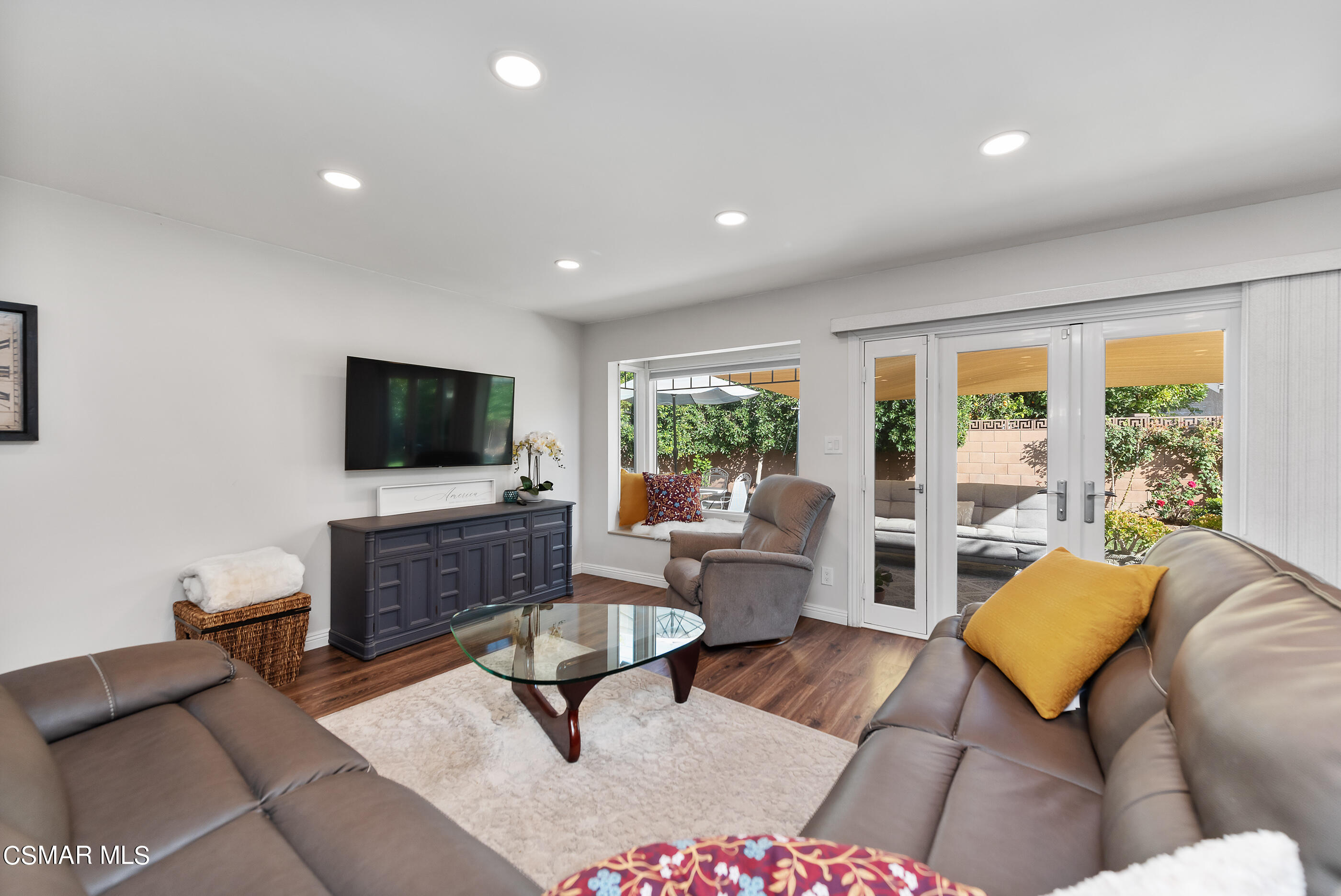 2066 Hurles Avenue Simi Valley, CA 93063 - Photo 16 of 50 a living room with furniture and a flat screen tv