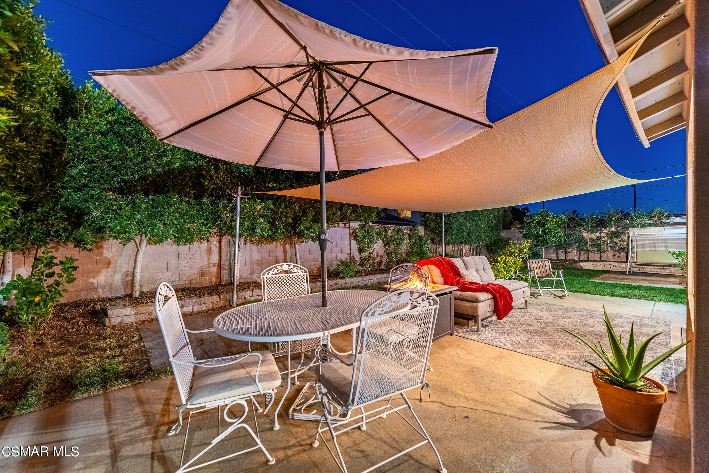 2066 Hurles Avenue Simi Valley, CA 93063 - Photo 4 of 50 a patio with a patio table and chairs