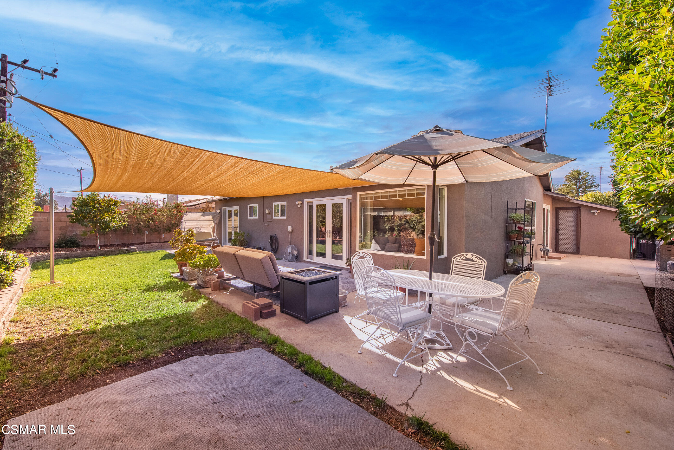 2066 Hurles Avenue Simi Valley, CA 93063 - Photo 32 of 50 a patio with glass top table and chairs