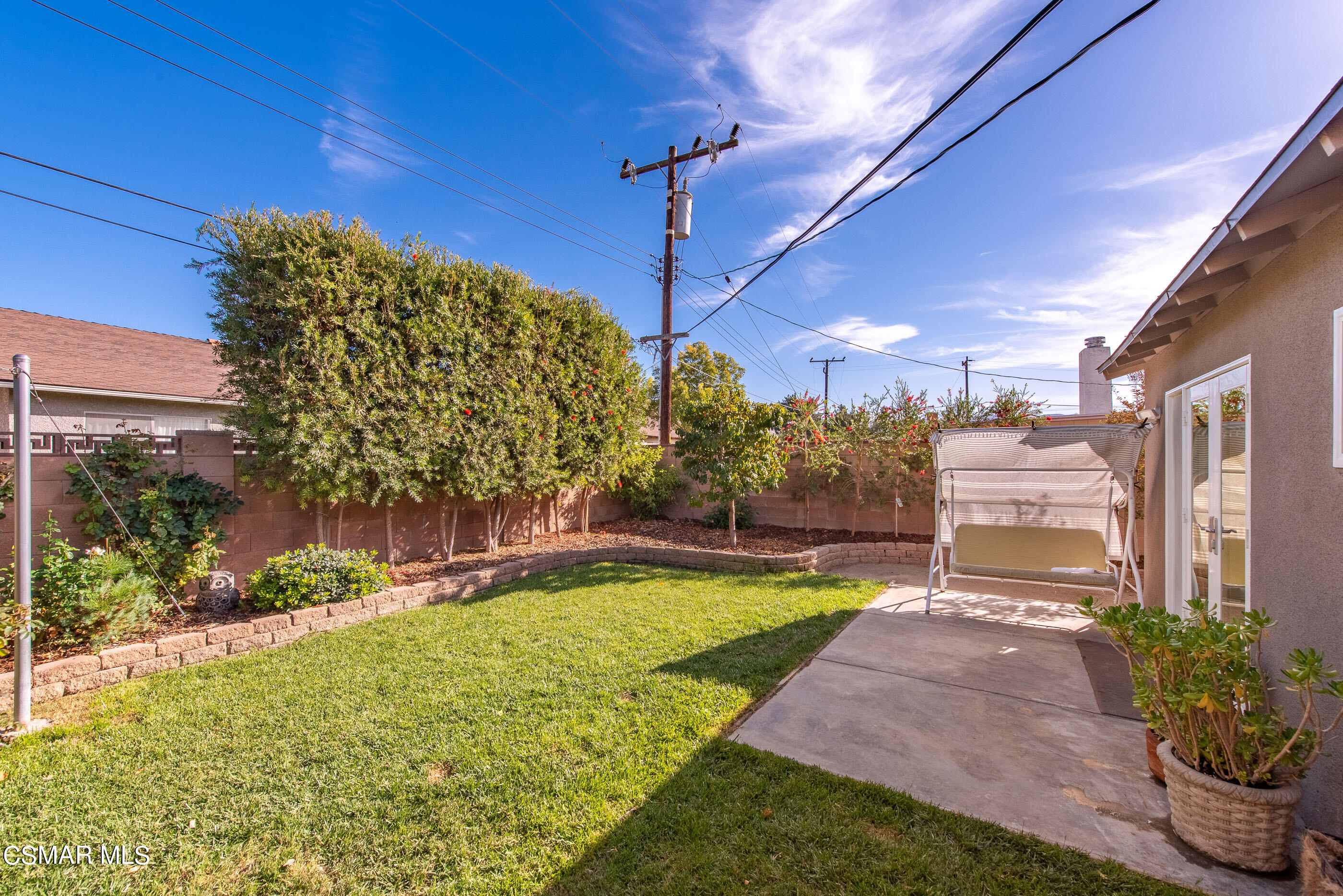 2066 Hurles Avenue Simi Valley, CA 93063 - Photo 35 of 50 a view of a swimming pool with an outdoor space and seating area