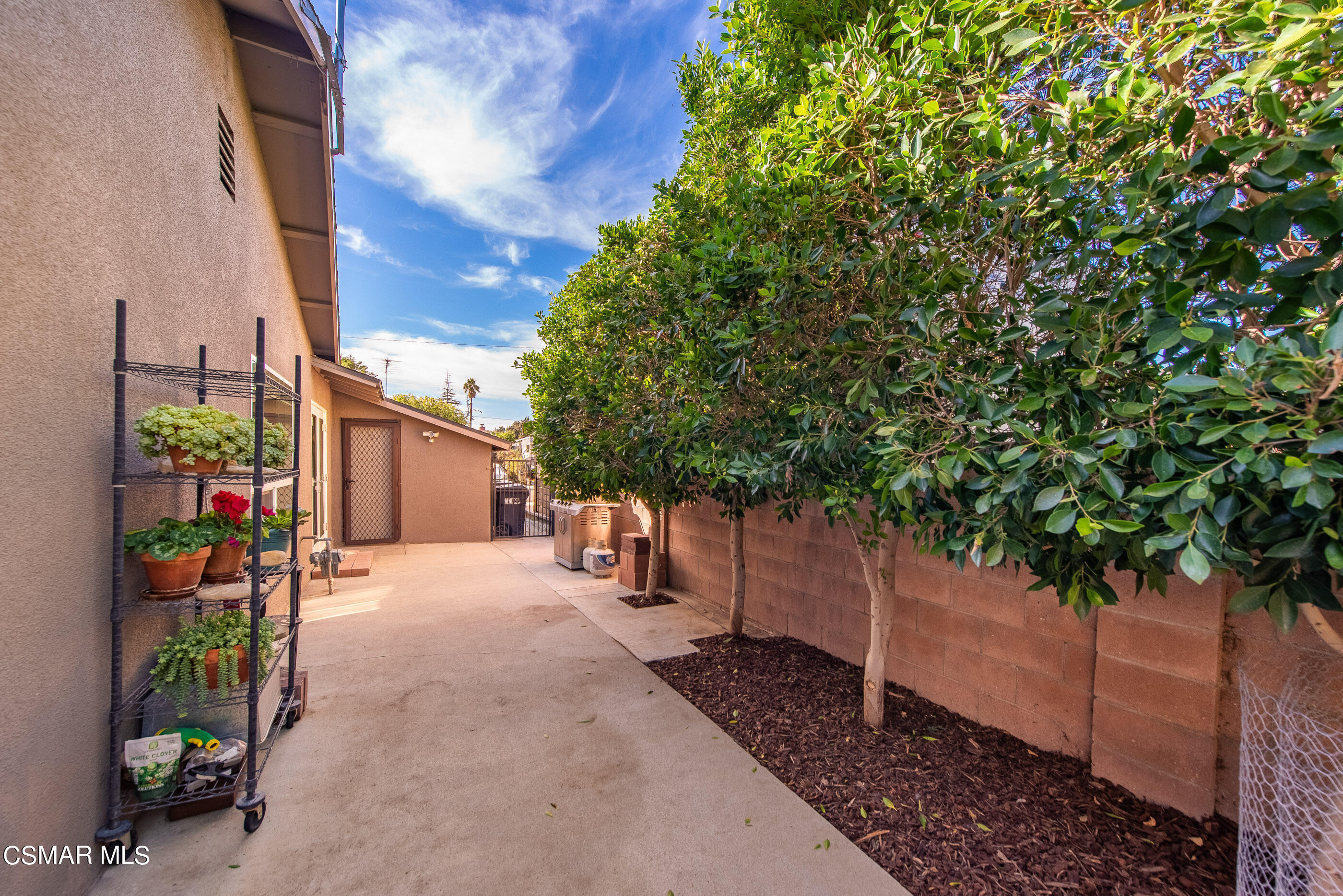 2066 Hurles Avenue Simi Valley, CA 93063 - Photo 40 of 50 a view of a street with potted plants