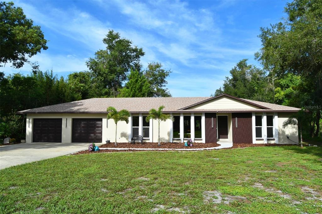 1444 Bird Road Casselberry, FL 32707 - Photo 2 of 70 a front view of a house with a yard