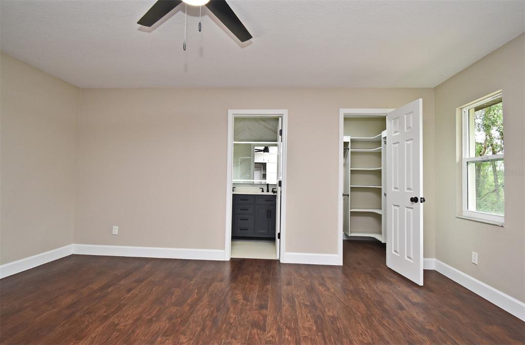 1444 Bird Road Casselberry, FL 32707 - Photo 24 of 70 a view of empty room with wooden floor and window