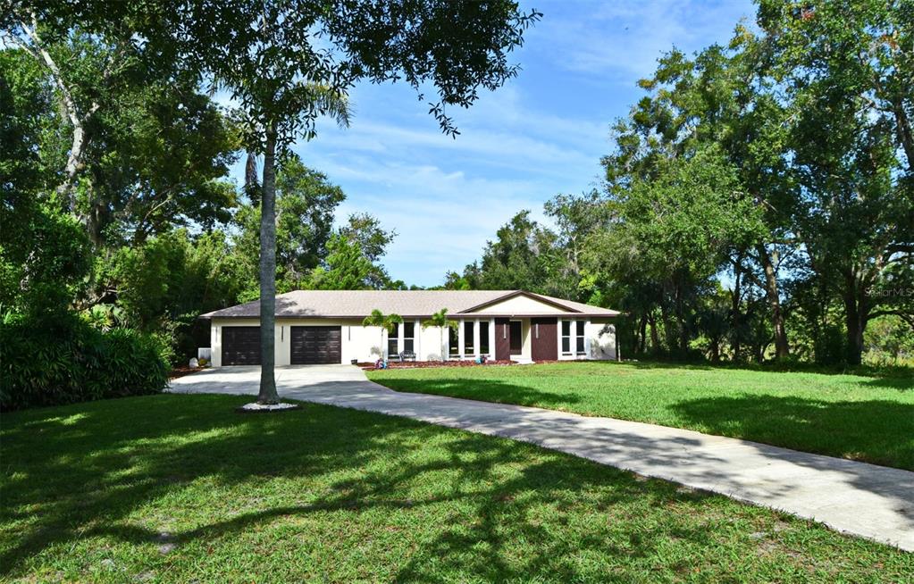1444 Bird Road Casselberry, FL 32707 - Photo 3 of 70 a view of a house with a yard