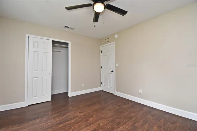 a bathroom with a double vanity sink toilet and shower