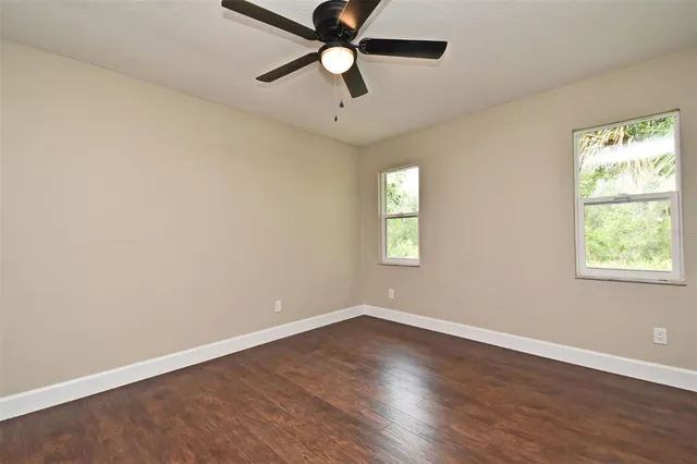 a view of an empty room with glass door