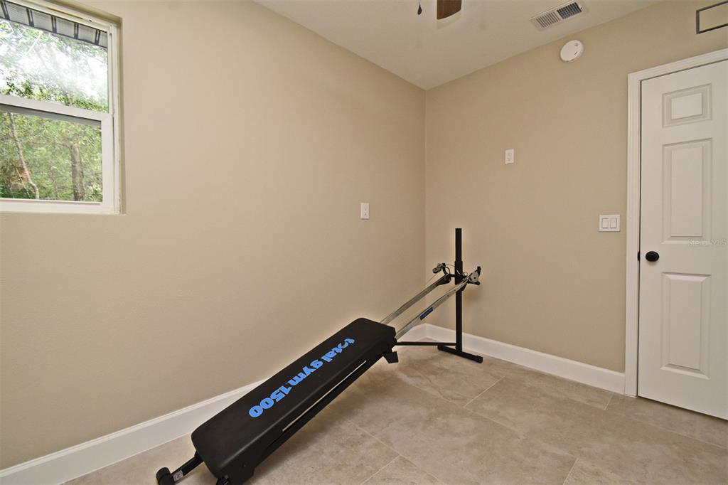 1444 Bird Road Casselberry, FL 32707 - Photo 40 of 70 a room with gym equipment and a window