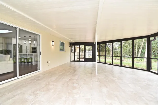 a view of a house with a tree in the background