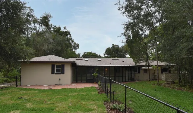 an aerial view of a house with outdoor space and street view