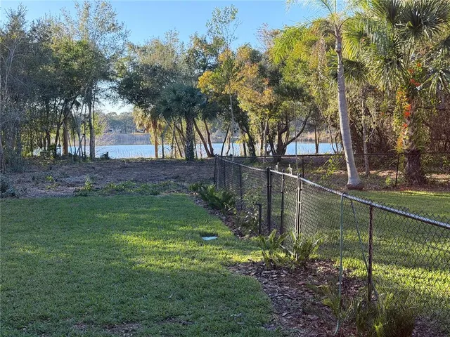 a front view of a house with a yard table and chairs