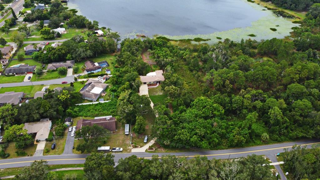 1444 Bird Road Casselberry, FL 32707 - Photo 59 of 70 an aerial view of a house with a yard basket ball court and outdoor seating
