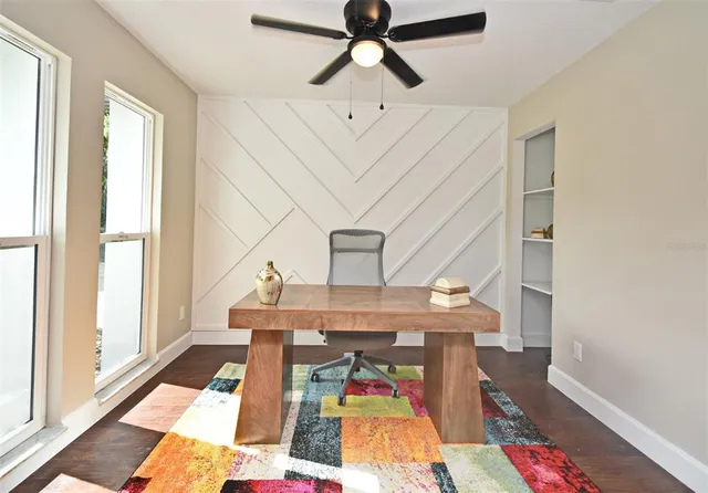 a view of a workspace with furniture