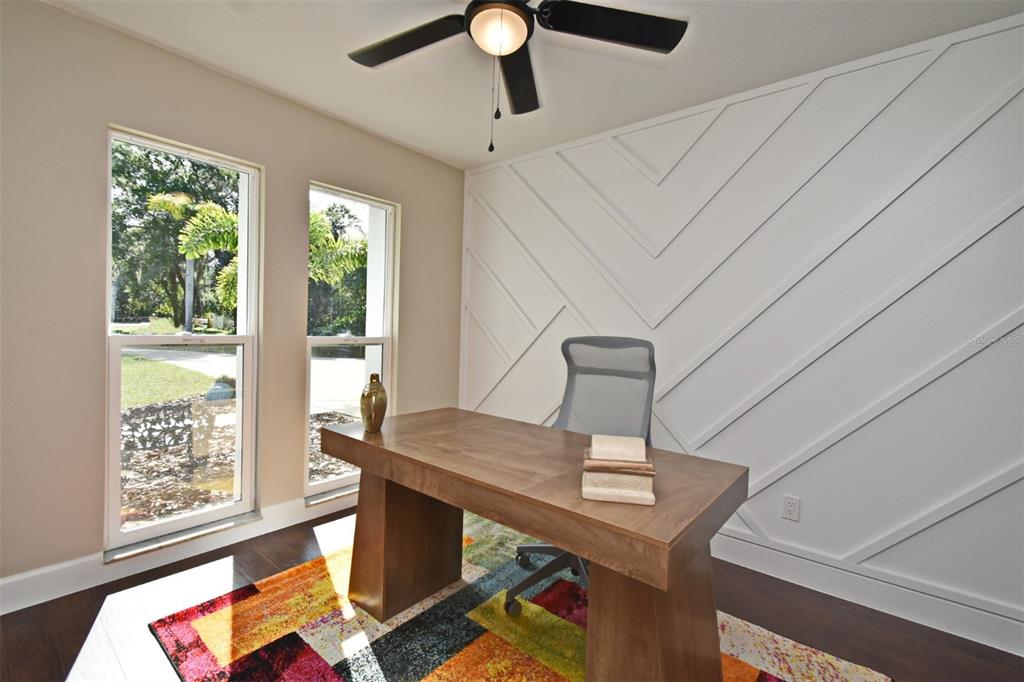 1444 Bird Road Casselberry, FL 32707 - Photo 9 of 70 a view of a workspace with furniture and a window