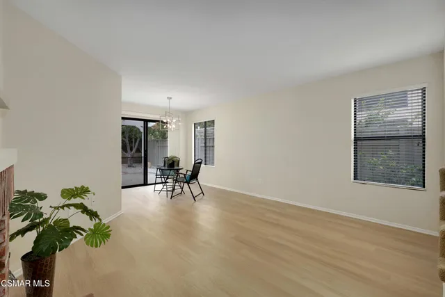 a view of livingroom with furniture and a potted plant