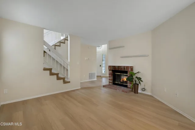a view of kitchen with furniture and a fireplace