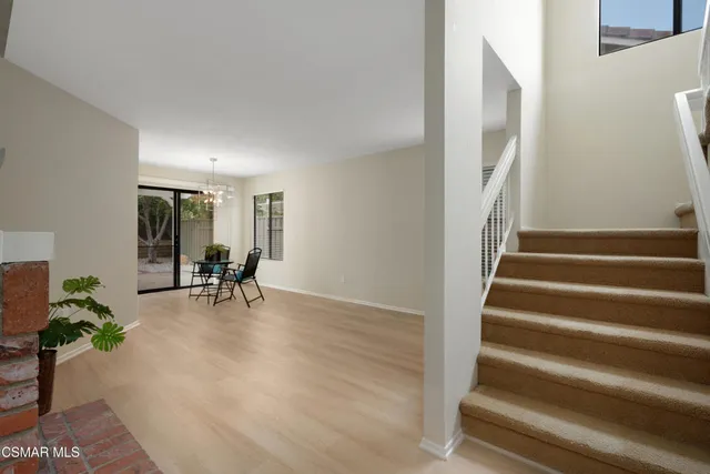 a view of an entryway with wooden floor and a potted plant