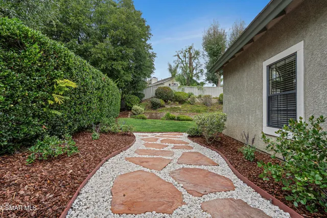 a view of a pathway with a house