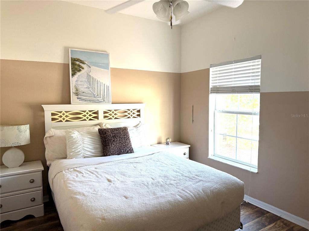 4573 Ada Lane Kissimmee, FL 34746 - Photo 9 of 37 a bedroom with a bed and a window