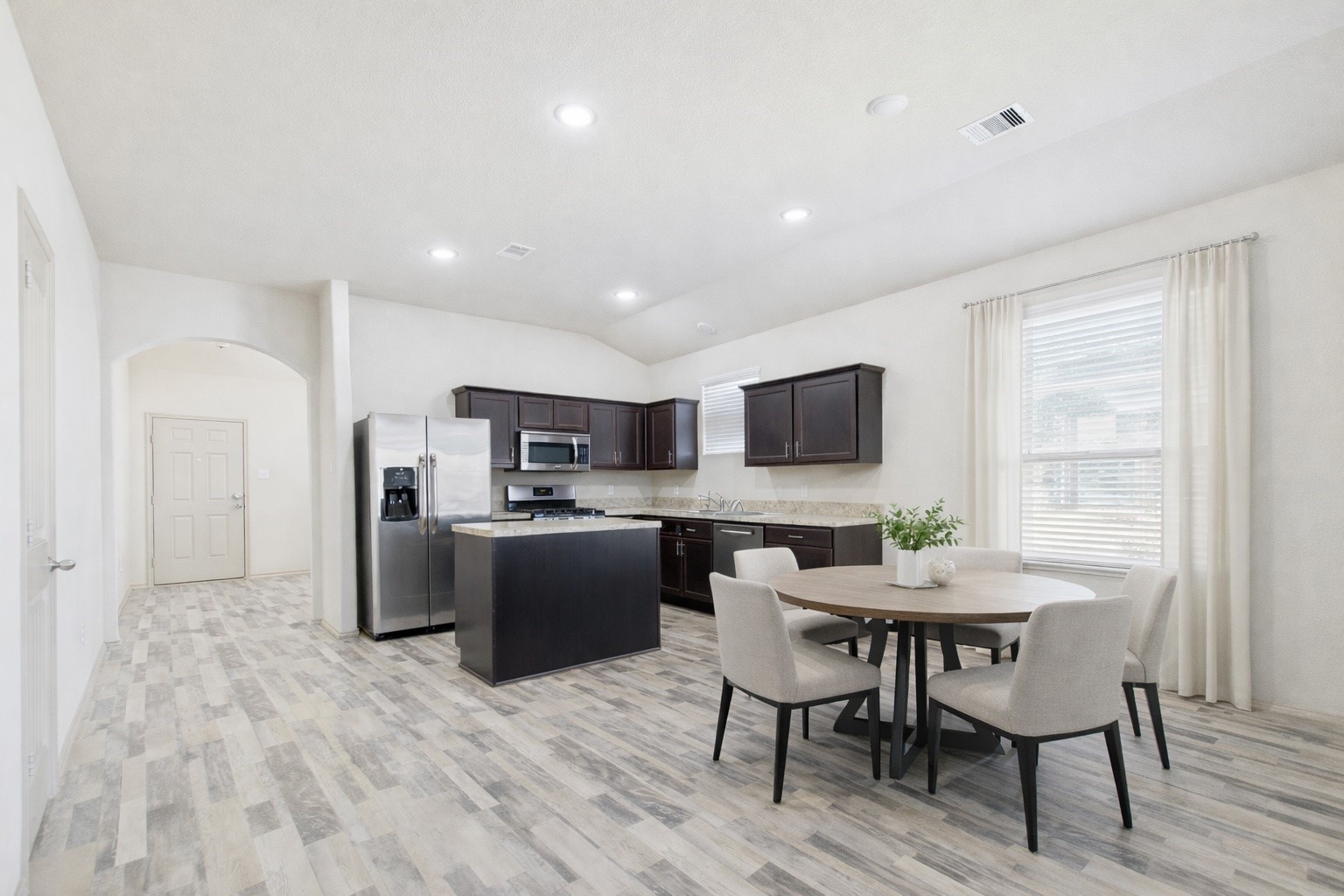 5206 Rosehill Ridge Court Katy, TX 77449 - Photo 5 of 20 The kitchen area is open to the living space and breakfast area(virtually staged)