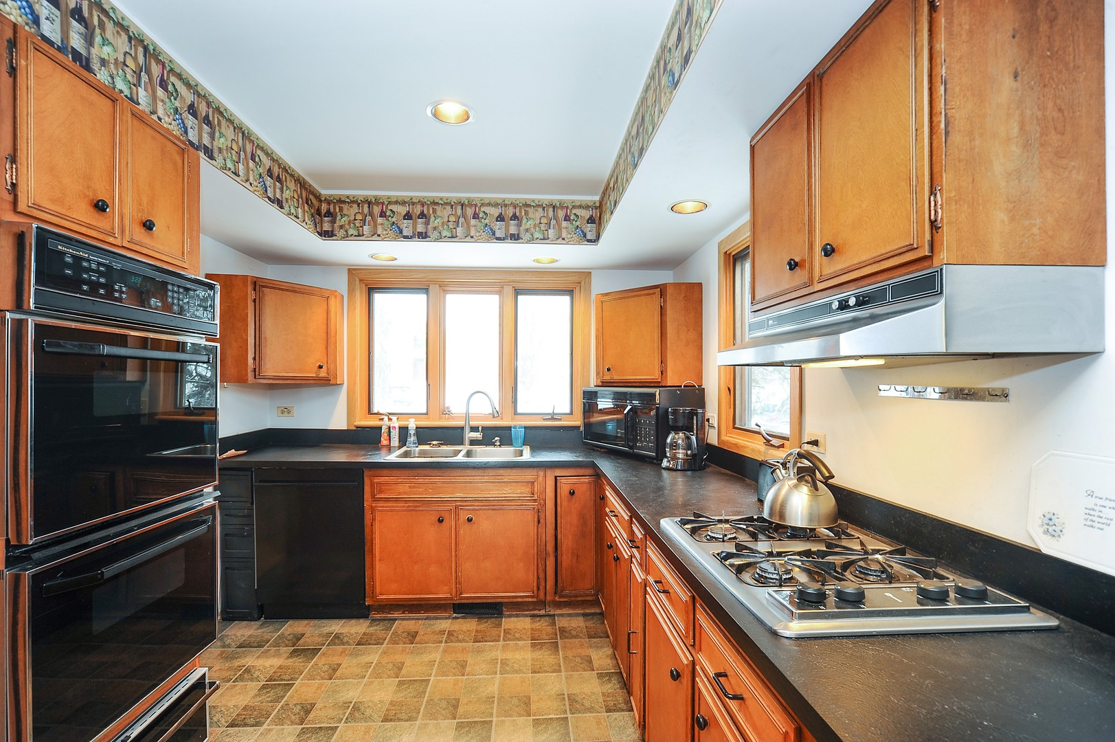 2120 Beechnut Road Northbrook, IL 60062 - Photo 2 of 10 a kitchen with stainless steel appliances granite countertop a stove sink and cabinets