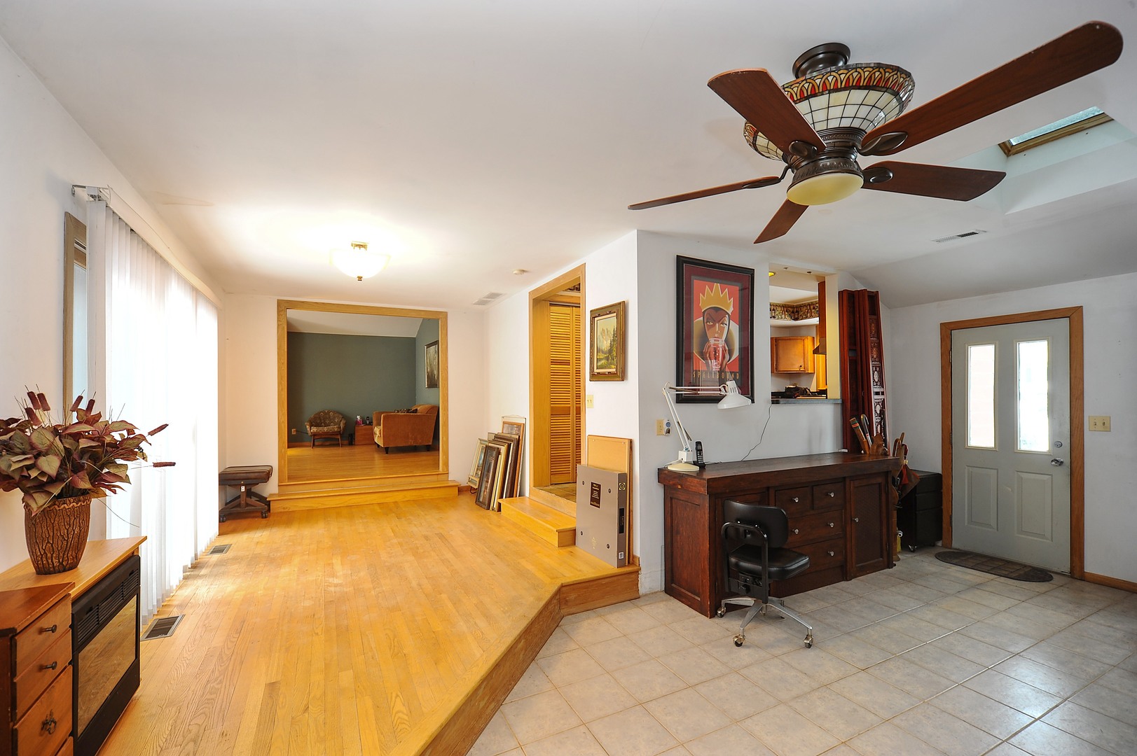 2120 Beechnut Road Northbrook, IL 60062 - Photo 3 of 10 a spacious bedroom with a bed a dresser and a chandelier