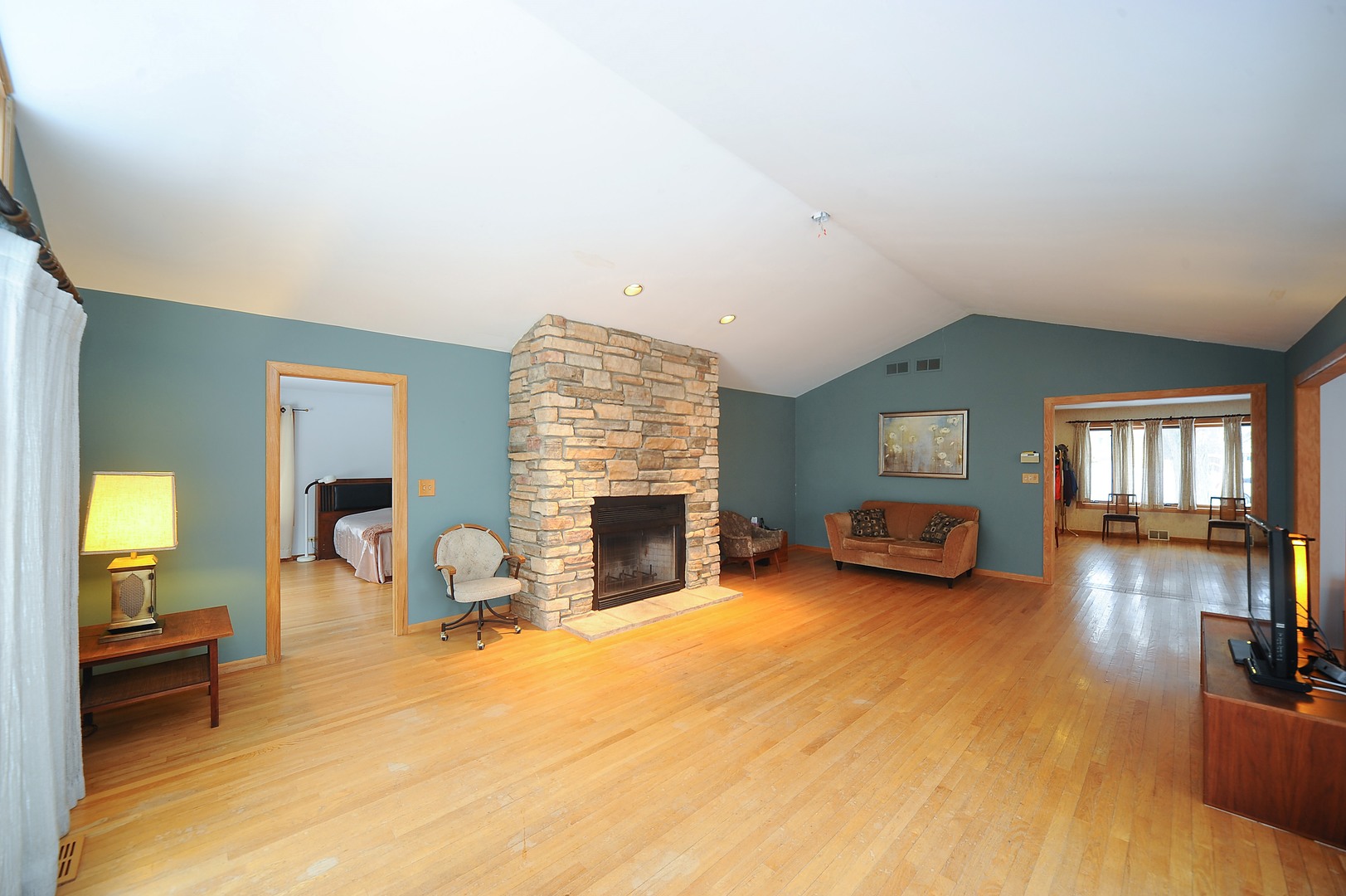 2120 Beechnut Road Northbrook, IL 60062 - Photo 6 of 10 a view of a livingroom with furniture a fireplace and wooden floor