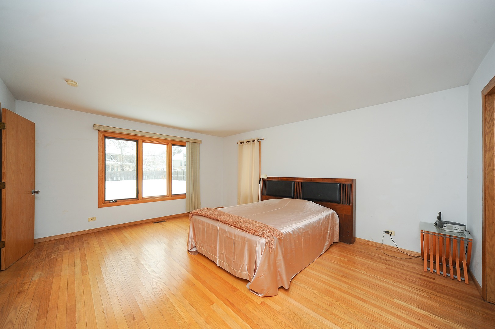 2120 Beechnut Road Northbrook, IL 60062 - Photo 9 of 10 a bedroom with a bed and wooden floor