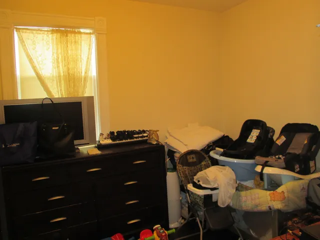 a kitchen with granite countertop a refrigerator stove and cabinets